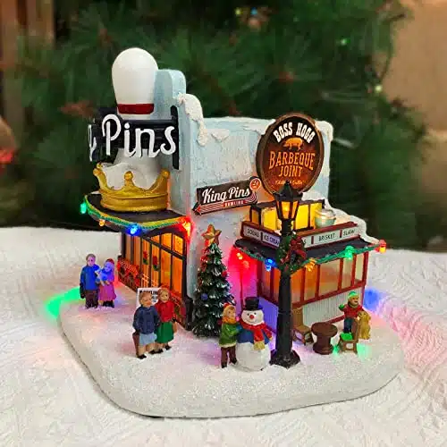 Moments in Time Christmas Village Building, King Pins Bowling Alley and Boss Hogg Barbeque Joint with LED Lights and Christmas Music   Battery Operated (not Included) (H x  x D)